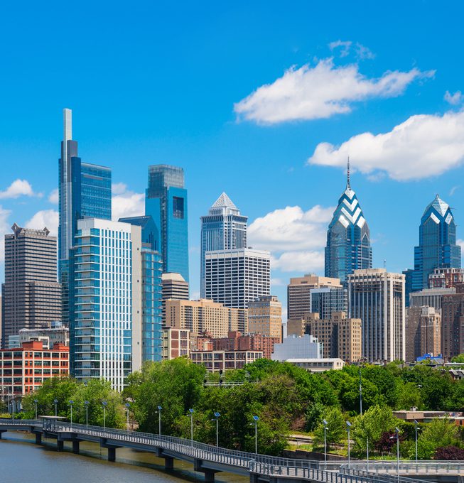 Downtown Philadelphia skyline view, with Delaware River walkway lining the water