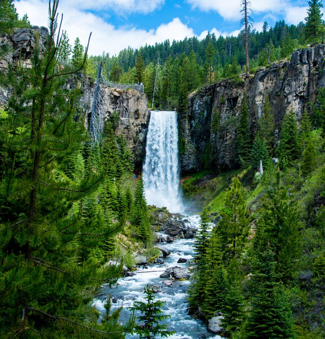 Captivating waterfall in Bend Oregon, captured during a warm summer day